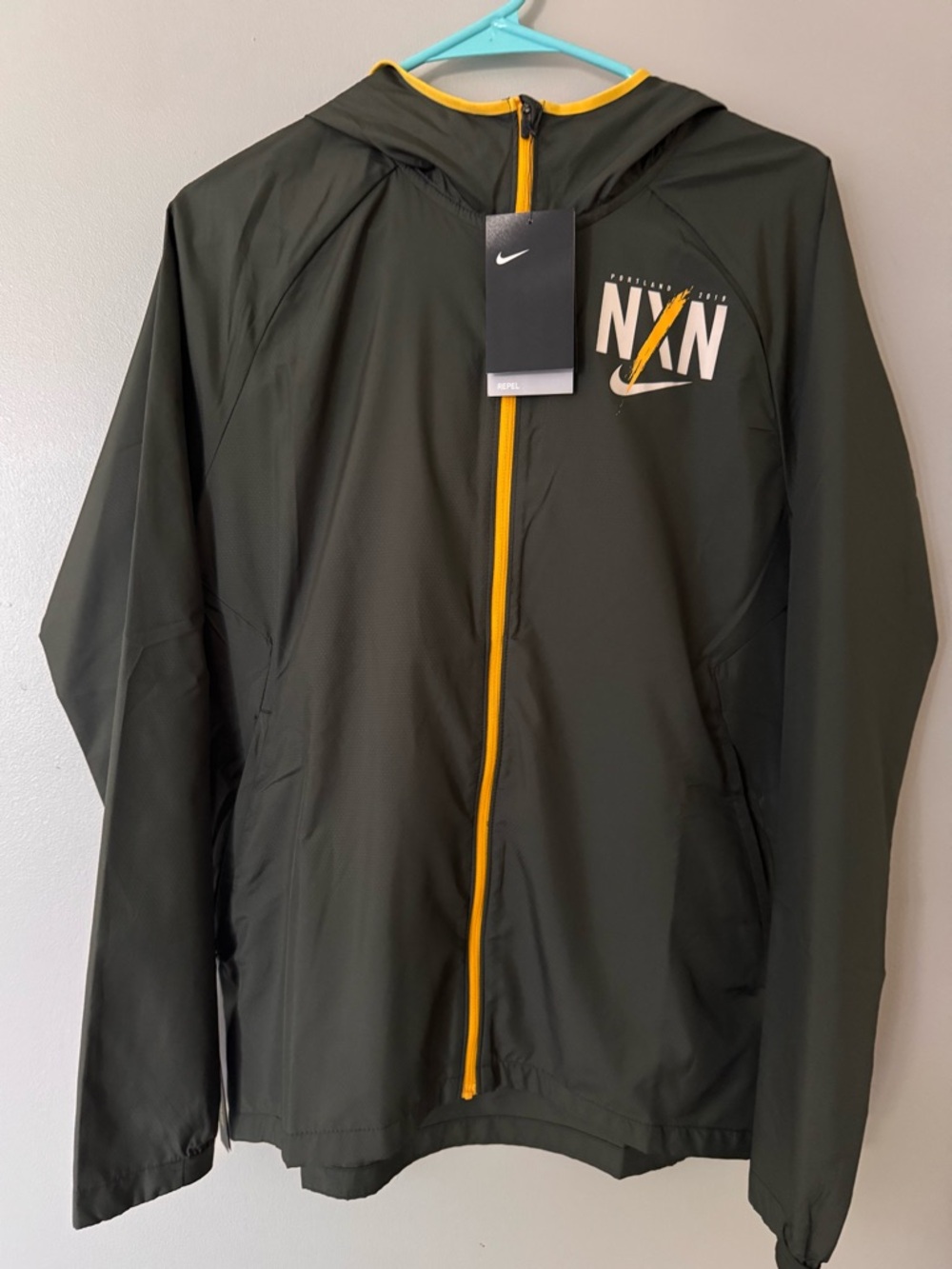 Nike Olive Green Hooded Jacket with Yellow Zip Accents